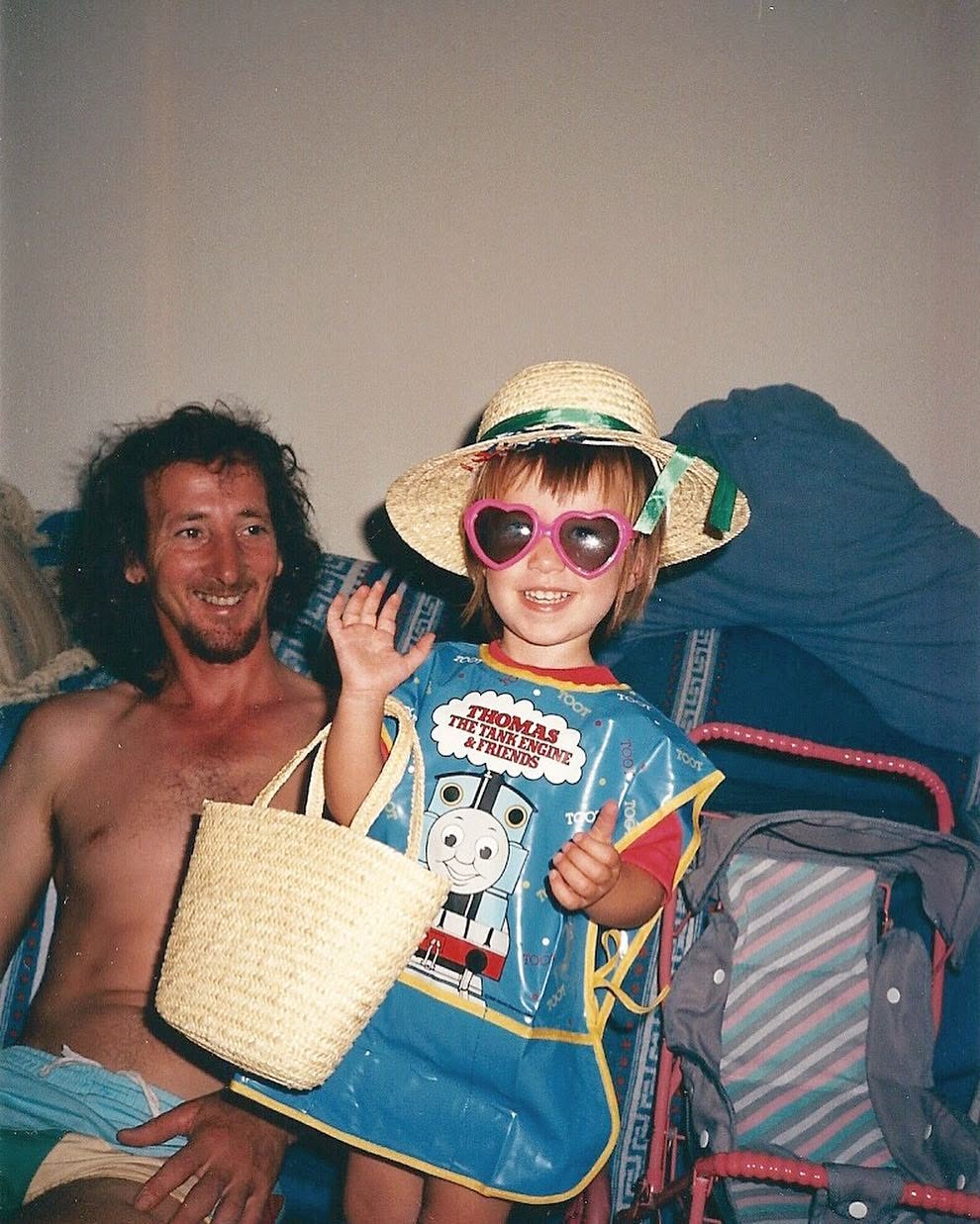 Jodie Louise as a small child in heart sunglasses with her father