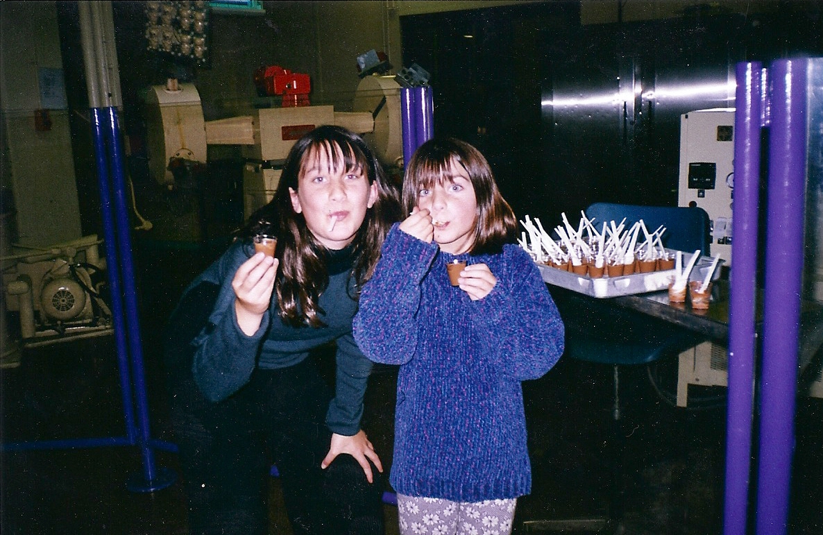 Jodie Louise and her sister eating sweets at the chocolate factory